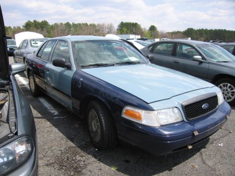 2001 Ford Crown Victoria - Photograph of a car in a lot, not a technical document.