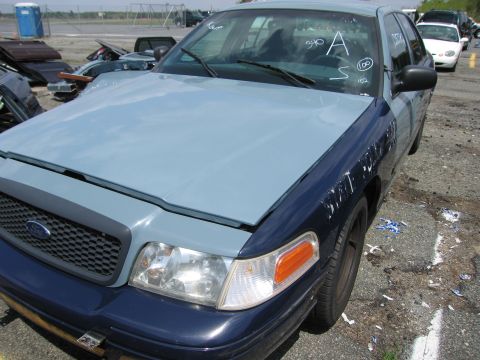 2001 Ford Crown Victoria - Photograph of a car in a lot, not a technical document.