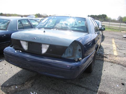 2001 Ford Crown Victoria - Photograph of a car in a lot, not a technical document.