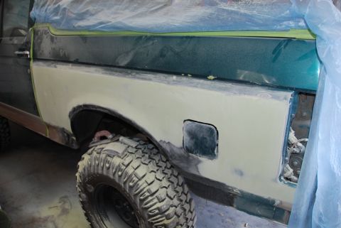 1996 Ford Bronco - Photograph of a truck bedside being prepped for repaint during restoration, not a technical document.
