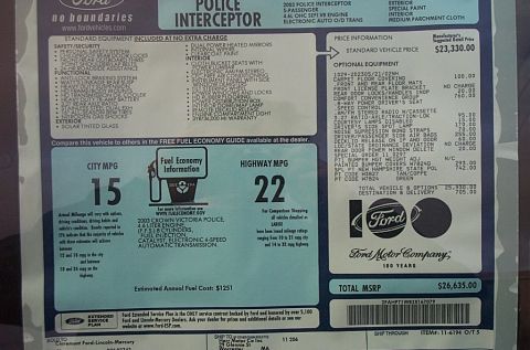 2001 Ford Crown Victoria - Factory window sticker (Monroney label) listing equipment, MPG, and pricing for a 2003 Crown Victoria Police Interceptor.