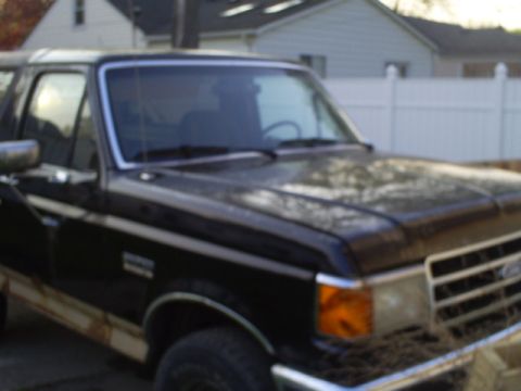 Black 1990 Ford Bronco front passenger side view