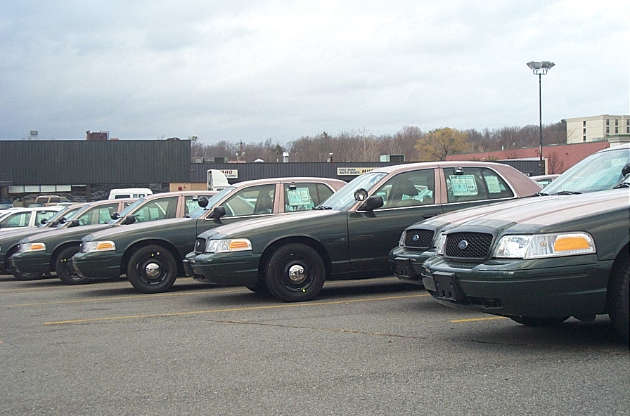 2001 Ford Crown Victoria sedans parked in a lot, front view
