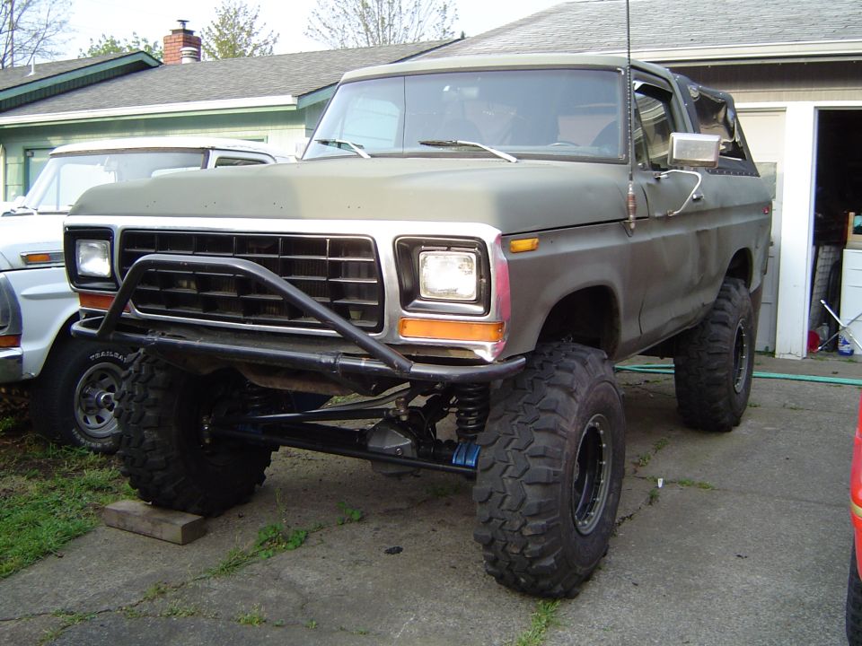 1978 Ford Bronco with brush guard and large off-road tires.