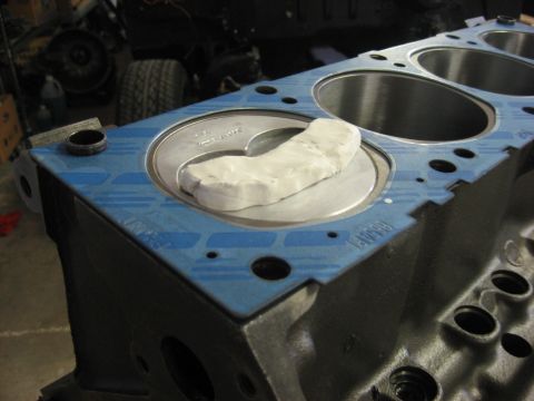 1965 Ford Galaxie - Modeling clay about 1/4" thick in the valve reliefs. Thin plastic bag on top of clay to keep valves from sticking to clay.