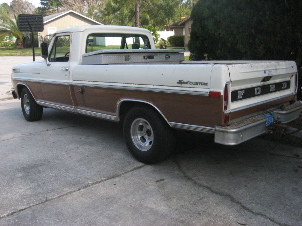 1972 Ford F-100 pickup truck, rear driver's side view, brown and white, with toolbox and aftermarket wheels