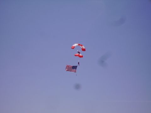 1990 Ford Bronco - A hot air balloon drifts across a clear blue sky.