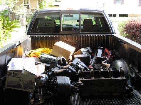 2006 Ford F-150 - Items loaded into the bed of a pickup truck, obscuring the tailgate and rear window.