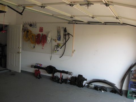 2006 Ford F-150 - The interior of a garage is shown, with a vehicle parked inside.