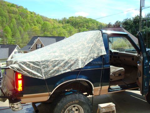 1995 Ford Bronco - This 1995 Ford Bronco features a custom digital camouflage soft top over its bed.