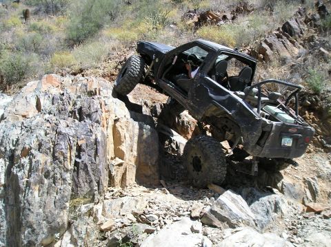 1986 Toyota Hilux - This modified 1986 Toyota Hilux navigates a steep, rocky incline during an off-road excursion.
