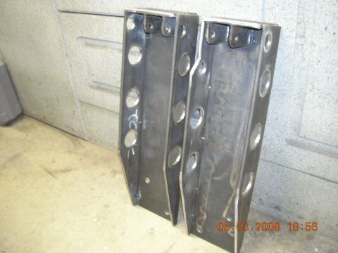 1996 Ford Bronco - Two custom steel brackets with holes for mounting and weight reduction.