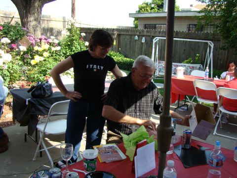 1989 Ford Bronco - A backyard party is underway with people mingling and gifts being opened.