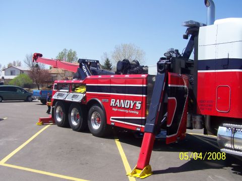 1972 Ford Ranchero - A large red and black tow truck is parked in a lot, with a date stamp of 05/04/2008.