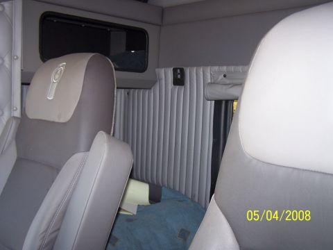 1972 Ford Ranchero - Interior of a truck cab with two seats and padded grey walls, dated 05/04/2008.