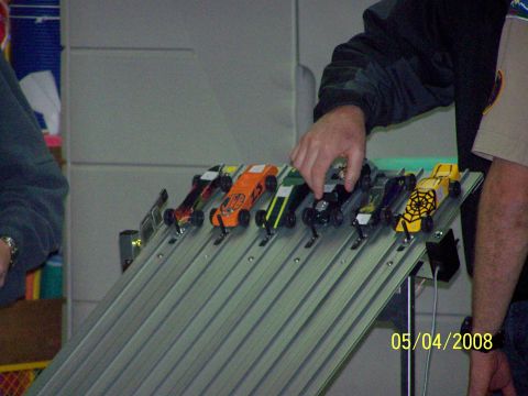 1972 Ford Ranchero - Pinewood derby cars ready for a race on a multi-lane track.