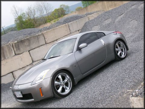2003 Nissan 350Z - This 2003 Nissan 350Z is shown from a three-quarter front angle, parked on a gravel surface.