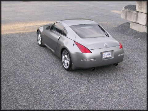 2003 Nissan 350Z - Rear view of a silver 2003 Nissan 350Z coupe, identified by its distinctive body style and badging.