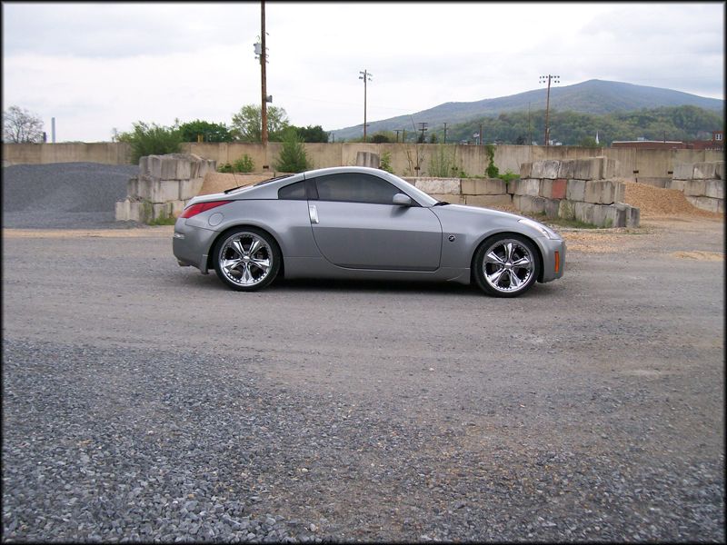 Silver 2003 Nissan 350Z parked on gravel lot