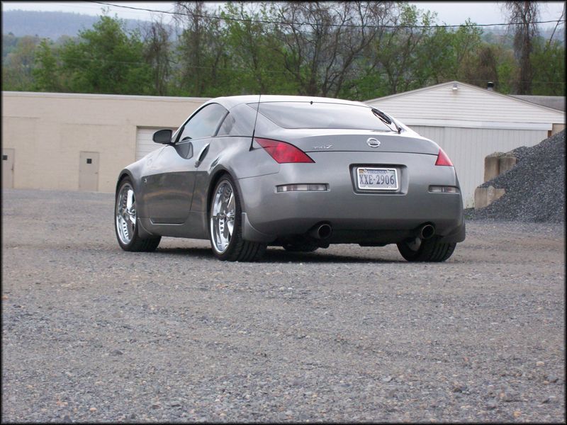 Gray 2003 Nissan 350Z parked on gravel, rear view