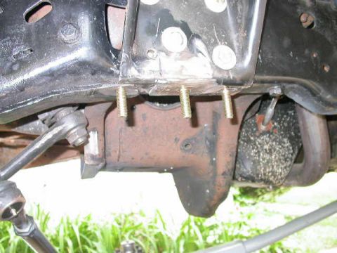 1990 Ford Bronco - I decided to make a bolt on upper trac bar mount instead of welding one on. You can see here where I replaced three rivets with bolts.