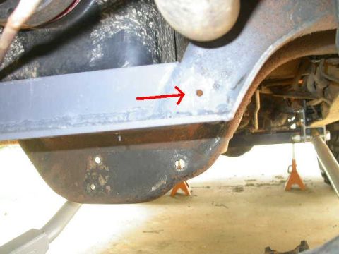 1990 Ford Bronco - This preexisting hole on the cross member also gets drilled out for mounting the trac bar mount brace.