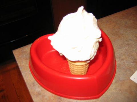 1985 Ford LTD Crown Victoria - A soft serve ice cream cone sits in a red heart-shaped bowl.