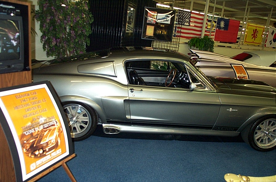 Silver Eleanor-style 1967 Shelby GT500 Mustang fastback on museum display with placard
