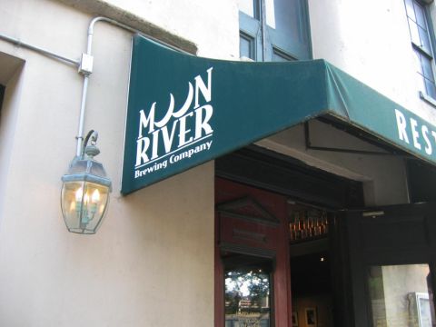1985 Ford LTD Crown Victoria - The entrance to Moon River Brewing Company features a prominent awning and an old-fashioned lantern.