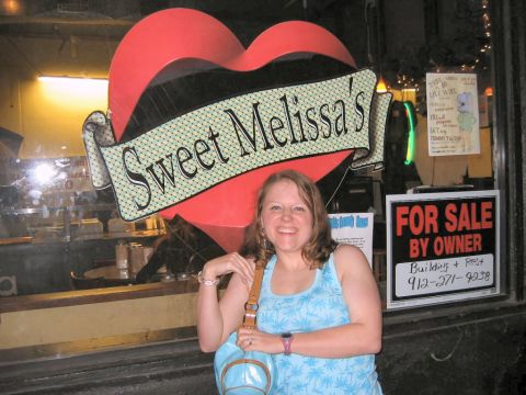 1985 Ford LTD Crown Victoria - A woman poses in front of a restaurant with a large heart sign and a 'For Sale By Owner' notice.