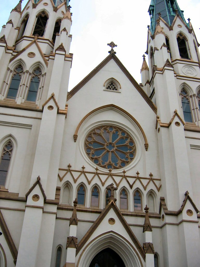 Cathedral facade with rose window and spires