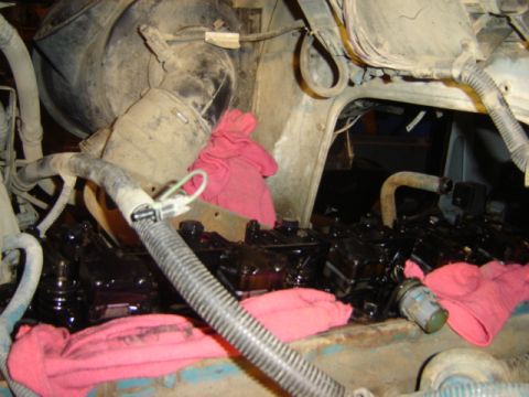 1992 Ford Bronco - Engine bay components are visible, with red rags placed around the engine parts.