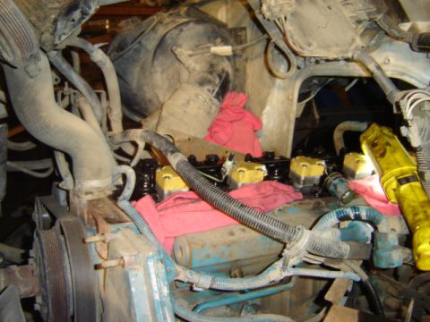 1992 Ford Bronco - Close-up view of an engine bay, showing valve covers and various hoses.