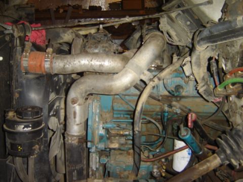 1992 Ford Bronco - Close-up view of an engine compartment, showing various pipes and mechanical components.