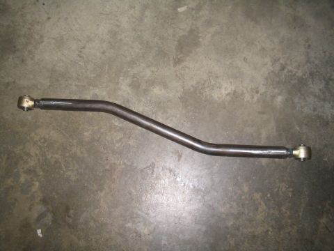 1979 Ford Bronco - A metal rod with threaded ends and spherical joints, likely a suspension or steering component.