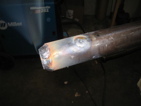 1979 Ford Bronco - A metal tube shows evidence of welding, with a Miller welding machine in the background.