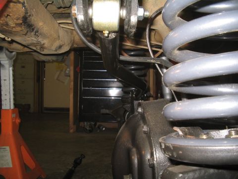 1979 Ford Bronco - Vehicle suspension components are visible, including springs and a sway bar link.