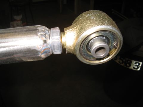 1979 Ford Bronco - A close-up view of a suspension part, highlighting its welded construction and bearing assembly.