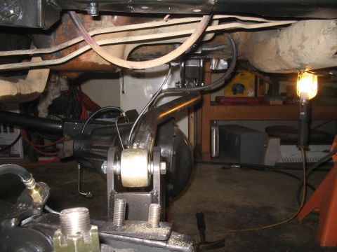 1979 Ford Bronco - Close-up view of the rear axle and suspension system of a vehicle, likely undergoing maintenance or modification.