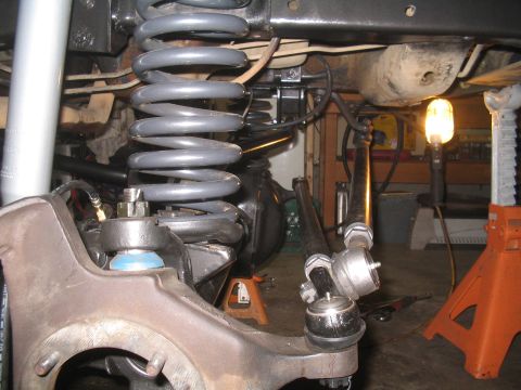 1979 Ford Bronco - Undercarriage view of a vehicle's suspension system, showing modified components and heavy-duty springs.