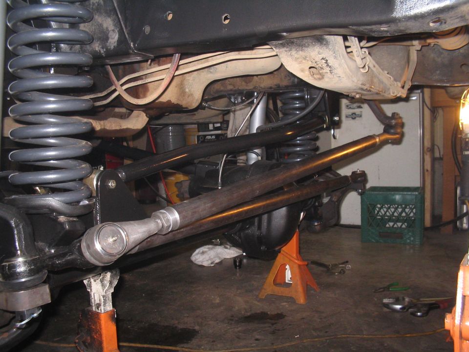 Undercarriage view of a vehicle's suspension and steering linkage