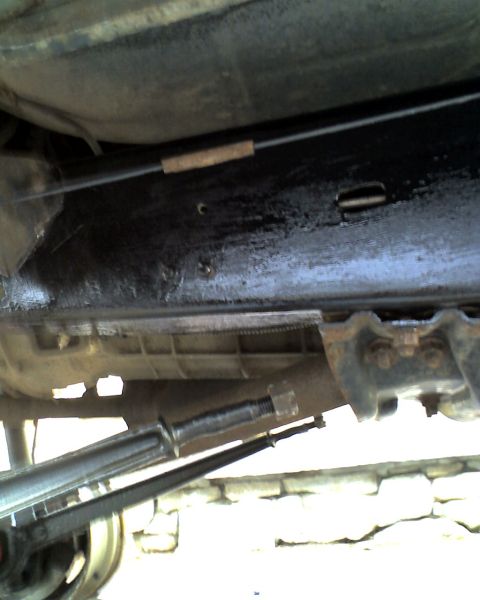 1996 Ford F-150 - Close-up view of the undercarriage, showing mechanical components and a watermark from Supermotors.net.