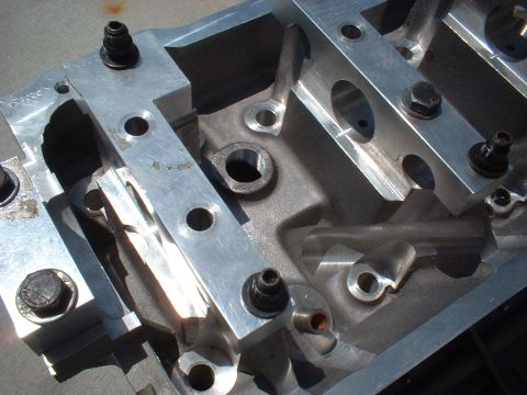 1964 Ford 427 - This is a close-up view of a machined aluminum engine block component, likely a performance part.
