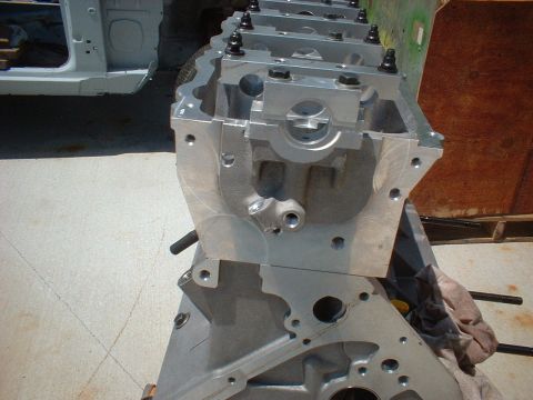 1964 Ford 427 - Engine block components are visible, with a car body in the background.