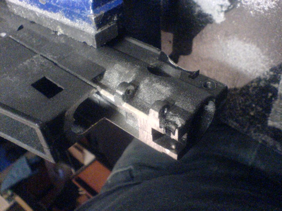 Close-up of firearm bolt carrier group in a vise