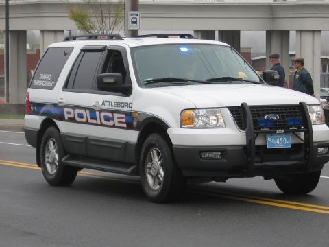 1991 Ford LTD Crown Victoria - White Attleboro Police Ford Expedition marked Traffic Enforcement with push bar driving down a street.