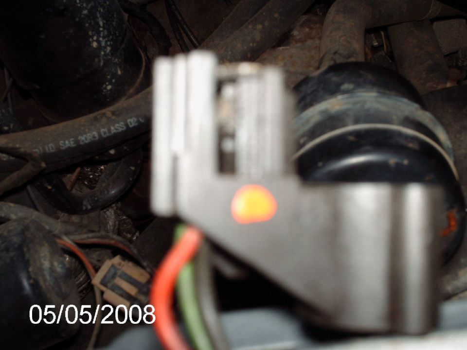 Engine compartment electrical connector with orange indicator light