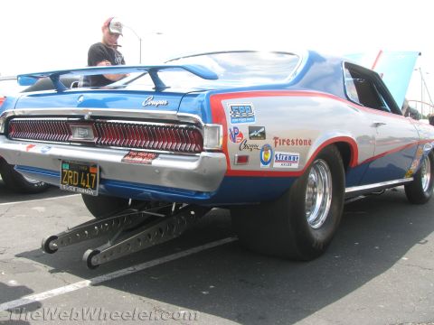 1968 Ford Mustang - Rear view of a 1968 Mercury Cougar modified for drag racing, showing its wide slicks and spoiler.