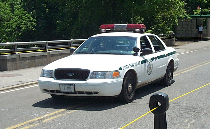 White 2001 Ford Crown Victoria police car with State Park Police markings and light bar