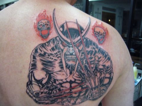 1991 Ford Bronco - Wolverine tattoo with flaming skulls on upper back.